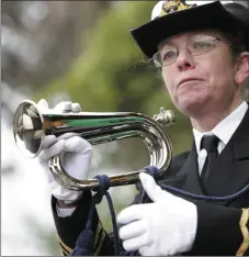  ??  ?? Lt Sue Williams, Commanding Officer of the Holyhead Sea Cadets, prepares to play a tribute to Rescue 116.