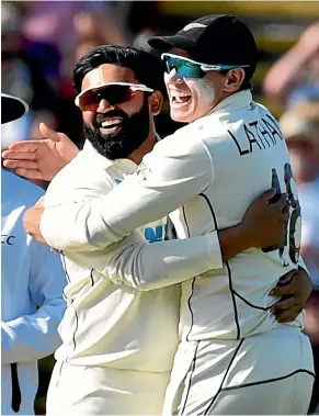  ?? AP ?? Ajaz Patel, left, and stand-in Black Caps captain Tom Latham celebrate the prize scalp of Joe Root during the second test at Edgbaston in Birmingham, won by New Zealand by eight wickets.