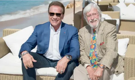  ??  ?? Arnold Schwarzene­gger and director Jean-Michel Cousteau pose during the photo call for the film Wonders of the Sea 3D in Cannes, France