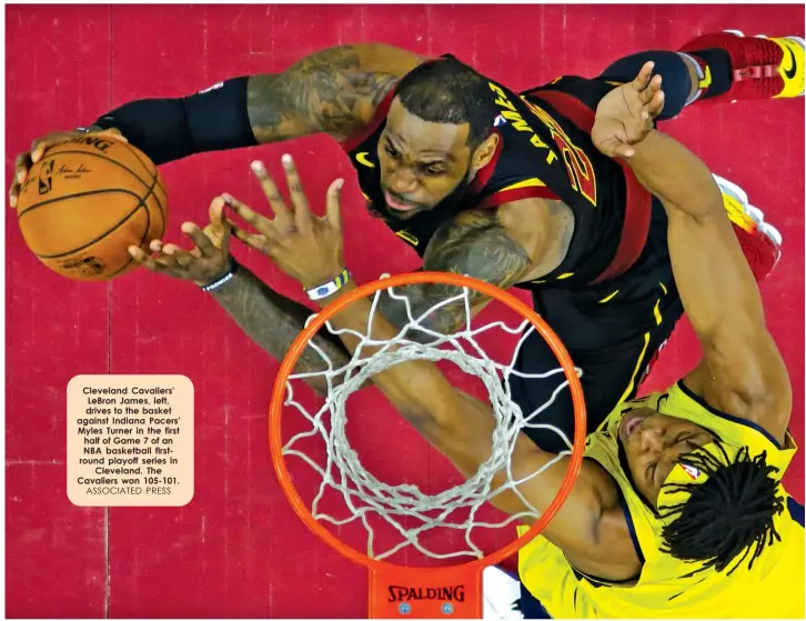  ?? ASSOCIATED PRESS ?? Cleveland Cavaliers' LeBron James, left, drives to the basket against Indiana Pacers' Myles Turner in the first half of Game 7 of an NBA basketball firstround playoff series in
Cleveland. The Cavaliers won 105-101.