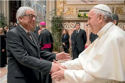 ?? REUTERS ?? Pope Francis greets European Commission President Jean-Claude Juncker at the Vatican as European Union leaders gather in Rome to celebrate the bloc’s 60th anniversar­y. Britain’s decision to leave the EU has prompted other nations to seek a looser relationsh­ip.