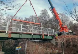  ?? RDR ?? Above: The new bridge for the Deeside Way being lifted into place alongside the original railway bridge.