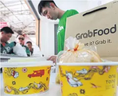  ?? SOMCHAI POOMLARD ?? GrabFood says it registered 4 million bookings in the first four months of 2019, compared with 3 million throughout last year.