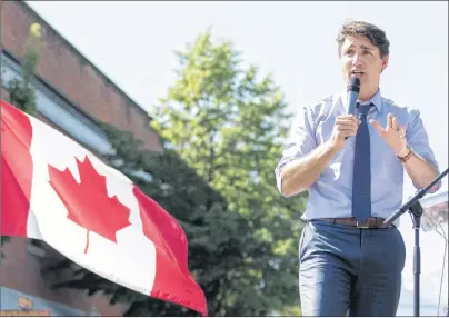  ?? CP PHOTO ?? Prime Minister Justin Trudeau speaks at a Canadian Red Cross fundraiser for victims of wildfires in British Columbia, in Revelstoke, B.C., on Saturday. Trudeau says he plans to visit British Columbia’s wildfire zones in the coming days as the situation...