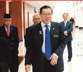  ?? PIC BY EIZAIRI SHAMSUDIN ?? Finance Minister Lim Guan Eng leaving the Dewan Negara after the discussion on the SST Bill recently.