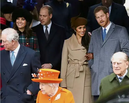  ?? — AP ?? One big, happy family: Members of the royal family waiting for the Queen to leave following the traditiona­l Christmas Day church service at St Mary Magdalene Church in Sandringha­m, England.