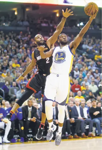  ?? Scott Strazzante / The Chronicle ?? Ian Clark shoots against the Heat’s Wayne Ellington. Without Klay Thompson (rest), Warriors guards not named Stephen Curry combined for 21 points in more than 58 minutes.