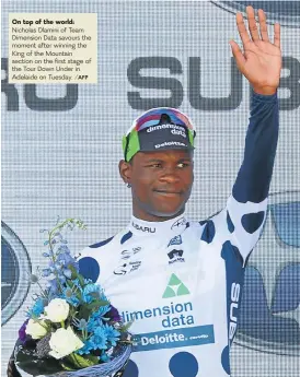  ?? /AFP ?? On top of the world: Nicholas Dlamini of Team Dimension Data savours the moment after winning the King of the Mountain section on the first stage of the Tour Down Under in Adelaide on Tuesday.