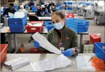  ?? DAI SUGANO — STAFF ARCHIVES ?? Election worker Jacqueline M. Bond processes ballots on Nov. 9at the Santa Clara County Registrar of Voters in San Jose.