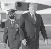  ?? SAULLOEB/GETTY-AFP ?? President Donald Trump walks toward Air Force One before departing Wednesday from Joint Base Andrews, Maryland, for his Mar-a-Lago resort in Florida where he and his family will spend the holidays.