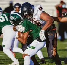  ?? Anthony Brunsman / MaxPreps ?? McClymonds lineman Simeon Mitchell (56) is part of a defense that has allowed only 14 points in two games this season.