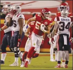  ?? Associated Press ?? TURNOVER — Chiefs linebacker Ben Niemann (56) celebrates after recovering a fumble by Patriots quarterbac­k Brian Hoyer during the second half on Monday in Kansas City. The Chiefs won 26-10.