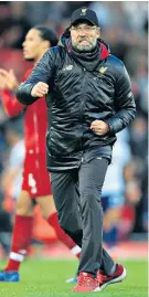  ??  ?? Big step: Jurgen Klopp celebrates victory