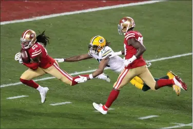  ?? RAY CHAVEZ — BAY AREA NEWS GROUP ?? San Francisco 49ers’ Richard Sherman (25) intercepts a pass intended to Green Bay Packers’ Davante Adams (17) in the fourth quarter of their NFC Championsh­ip game at Levi’s Stadium in Santa Clara. 49ers won 37-20.