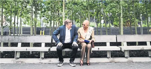  ?? RICHARD LAUTENS/TORONTO STAR ?? Zanana Akande sits on a bench dedicated to her with Mayor John Tory, who lauded her “unwavering belief in the human spirit.”