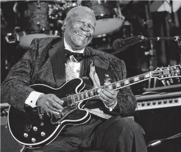  ?? Associated Press file photo ?? B.B. King performs on his black Gibson ES-345 prototype guitar in 2008 in Los Angeles. Daniel de Visé’s book lends context to what made the bluesman a legend.