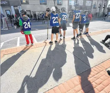  ??  ?? After days of rain leading up to the event, the JStrong Cup saw two days of sunshine. At times the sun cast some long shadows of players “on the bench.”