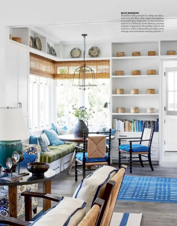  ??  ?? BLUE HORIZONS
Panelled walls painted in a deep-sea blue and intricate floor tiles create atmosphere in a sunlit spot (opposite). In the breakfast nook of a California home (below), touches of green inspired by the garden enliven the interiors, while a banquette provides extra storage and maximises seating options. >