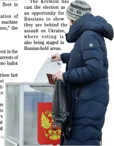  ?? VLADIMIR NIKOLAYEV/AGENCE FRANCE-PRESSE ?? WOMAN casts her ballot in Russia’s presidenti­al election in the Siberian city of Novosibirs­k on 17 March 2024.