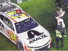  ?? PHELAN M. EBENHACK / ASSOCIATED PRESS ?? William Byron celebrates his win with team owner Rick Hendrick in February’s Daytona 500 in Florida.