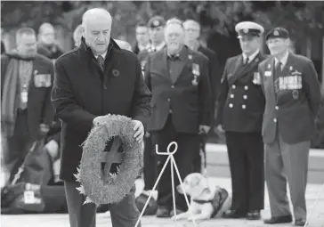  ?? ADRIAN WYLD/ THE CANADIAN PRESS ?? Minister of Veterans Affairs Julian Fantino, with wreath at the National War Memorial in Ottawa last November, drew the ire of a group of veterans on Tuesday when he was late to a meeting and then berated them for being upset.