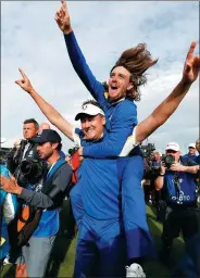  ?? PAUL CHILDS / REUTERS ?? Team Europe's Ian Poulter and Tommy Fleetwood celebrate after winning the Ryder Cup in France on Sunday.