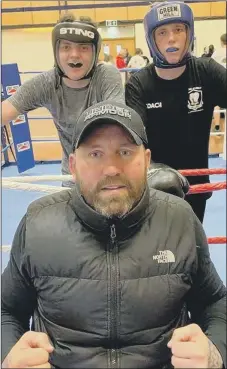  ??  ?? BOXING CLEVER Knox with two of Heart of Hayling Academy’s young boxers
