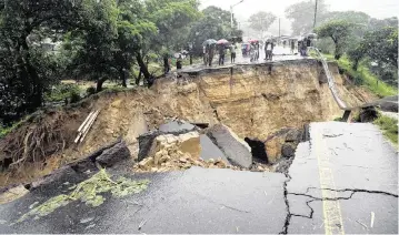  ?? THOKO CHIKONDI AP ?? A road connecting Blantyre and Lilongwe was damaged by heavy rains caused by Tropical Cyclone Freddy in Blantyre, Malawi, on Tuesday.