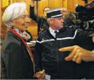  ?? ASSOCIATED PRESS FILE PHOTO ?? Internatio­nal Monetary Fund chief Christine Lagarde, left, arrives at the special Paris court in France.