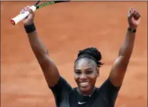  ?? CHRISTOPHE ENA — THE ASSOCIATED PRESS ?? Serena Williams of the U.S. celebrates as she defeats Germany’s Julia Georges during their third round match of the French Open tennis tournament at the Roland Garros stadium, Saturday in Paris.