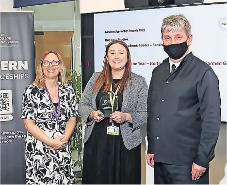  ?? ?? Excellent employers Carmen Girvan (centre), early careers supervisor, picked up the award on behalf of the team at the ceremony