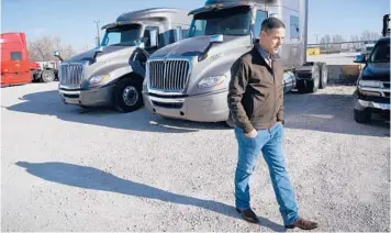 ?? CHARLIE NEIBERGALL/AP ?? Aaron Tennant, a self-described “very conservati­ve” Republican and trucking company owner, doesn’t understand why his U.S. House representi­ve voted against an infrastruc­ture bill that would have helped their Iowa district.