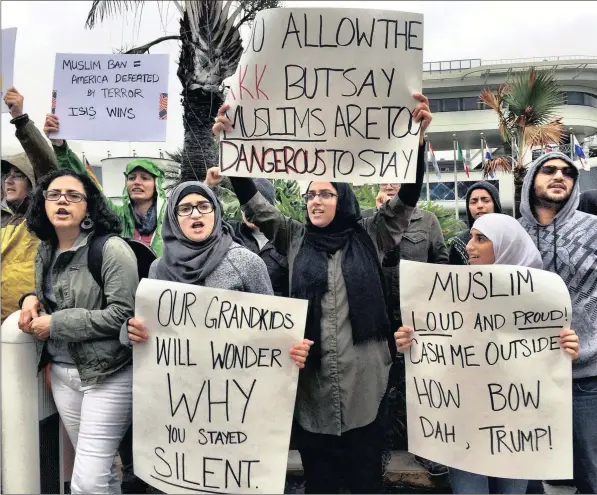  ?? PICTURE: CM GUERRERO / AP ?? OUTRAGE: Protesters rally against President Trump’s refugee ban at Miami Internatio­nal Airport on Sunday.