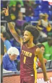  ?? STAFF PHOTO BY MATT HAMILTON ?? Tyner Academy’s Xavier Fisher waves to fans after Tuesday’s win against Bolivar Central in the TSSAA Class 2A state tournament in Murfreesbo­ro, Tenn.