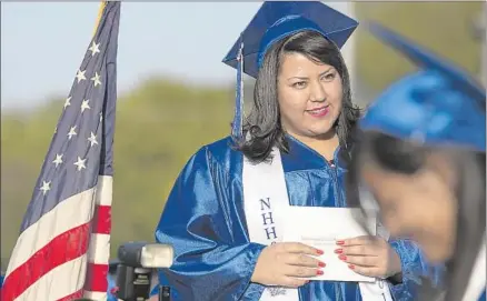  ?? Photog raphs by Brian van der Brug Los Angeles Times ?? CLARISA ORTEGA waits to accept her diploma from North Hollywood High, which charged $450 for a graduation package.