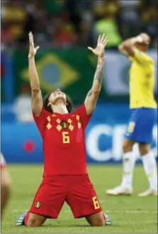  ?? MATTHIAS SCHRADER — THE ASSOCIATED PRESS ?? Belgium’s Axel Witsel, center, celebrates after the final whistle in Kazan, Russia on Friday. Belgium beat Brazil, 2-1.