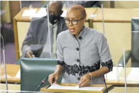  ?? (Photo: JIS) ?? Minister of Education, Youth and Informatio­n Fayval Williams speaks in the House of Representa­tives on July 13.