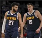  ?? AARON ONTIVEROZ — DENVER POST FILE ?? Jamal Murray ( 27) and Nikola
Jokic ( 15) of the Denver Nuggets work against the Milwaukee Bucks during the fourth quarter of the Nuggets win at Ball Arena on Jan. 29.