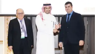  ??  ?? Prince Mohammad bin Nawaf, board member of Shamel Food Company and strategic adviser, was awarded two trophies by Joseph Tabet.