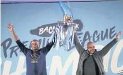  ?? REUTERS ?? Manchester City captain Vincent Kompany, left, and manager Pep Guardiola lift the Premier League trophy in 2019.