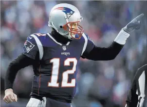  ?? Charles Krupa The Associated Press ?? New England Patriots quarterbac­k Tom Brady celebrates one of his team’s five first-half touchdowns against the Los Angeles Chargers in an AFC divisional-round victory Sunday.