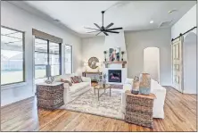  ?? [CENTRAL OKLAHOMA HOME BUILDERS ASSOCIATIO­N PHOTOS] ?? A view of the living area at Bear Creek Homes' entry at 301 Old Home Place in Settlers Ridge addition, which won Best Overall in the $370,000-$394,999 category of the Parade of Homes Fall Classic.