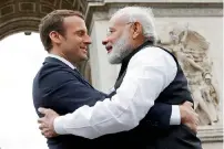  ?? AFP ?? Indian Prime Minister Narendra Modi says goodbye to French President Emmanuel Macron after a ceremony at the Arc de Triomphe in Paris on Saturday. —