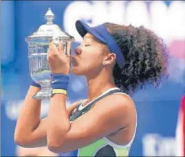  ??  ?? Naomi Osaka of Japan celebrates after beating Victoria Azarenka of Belarus in the US Open women's singles final at the Flushing Meadows on Saturday.