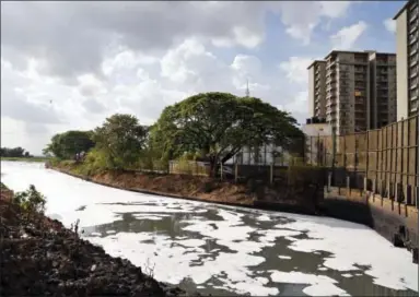  ?? AIJAZ RAHI — ASSOCIATED PRESS FILE PHOTO ?? In this June 5, 2017, file photo, toxic froth from industrial pollution floats on Bellundur Lake on World Environmen­t Day, in Bangalore, India. Environmen­tal pollution — from filthy air to contaminat­ed water — is killing more people every year than all...