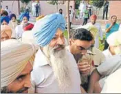  ?? HT PHOTO ?? Former Akali minister Sucha Singh Langah in police custody outside the court in Gurdaspur on Monday.