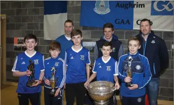  ??  ?? Augrim GAA Club’s winning captains with Mattie Forde, Denis Bastick and Robert Lambert.