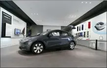  ?? CARLOS OSORIO - THE ASSOCIATED PRESS ?? A Tesla Model Y Long Range on Feb. 24, 2021, at the Tesla Gallery in Troy, Mich. U.S. auto safety regulators have opened an investigat­ion into Tesla’s Model Y SUV.