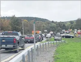  ?? WTEN VIA AP ?? Emergency personnel respond to the scene of a deadly crash in Schoharie, N.Y., on Saturday.