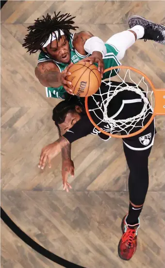  ?? GeTTy iMaGes File ?? RISING ABOVE: Robert Williams III dunks against Brooklyn’s Andre Drummond during Game 3 of the Celtics; Eastern Conference first round playoff series on Saturday.